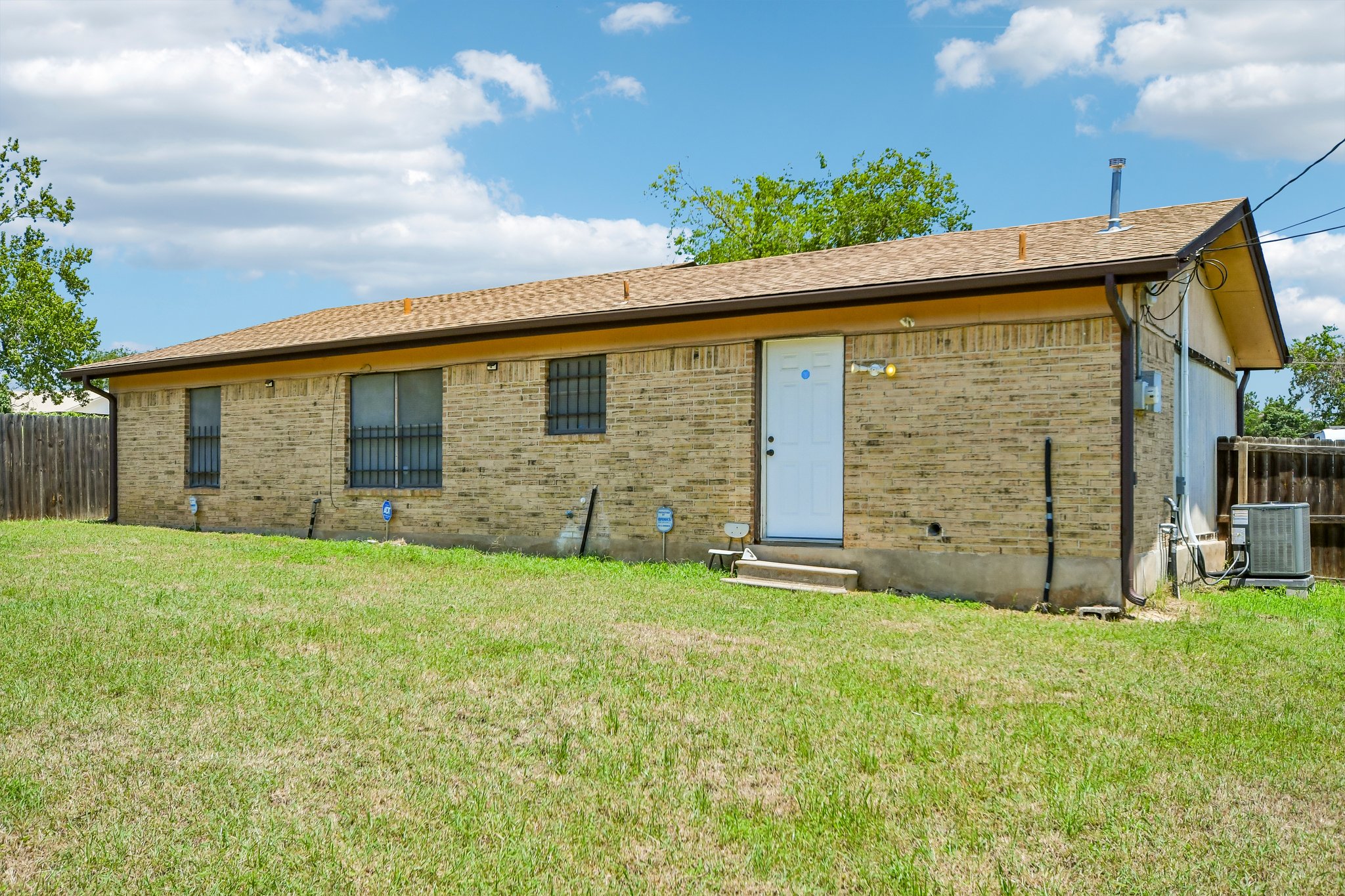 101 Brown Street Elgin, TX 78621 - Photo 27 of 32 a view of a backyard with a garden