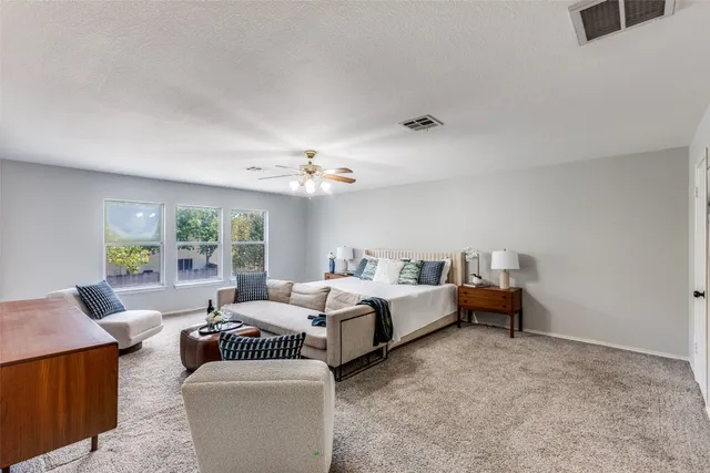 a bed room with bed and a window