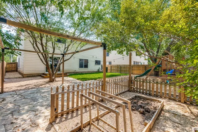 a view of a bench in the backyard