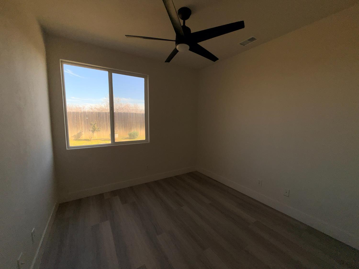 1977 Lemon Avenue Madera, CA 93637 - Photo 13 of 17 a view of an empty room with a window