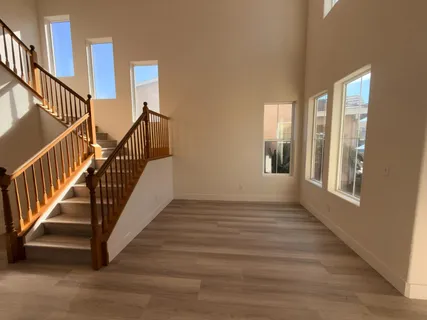 a view of an entryway with wooden floor