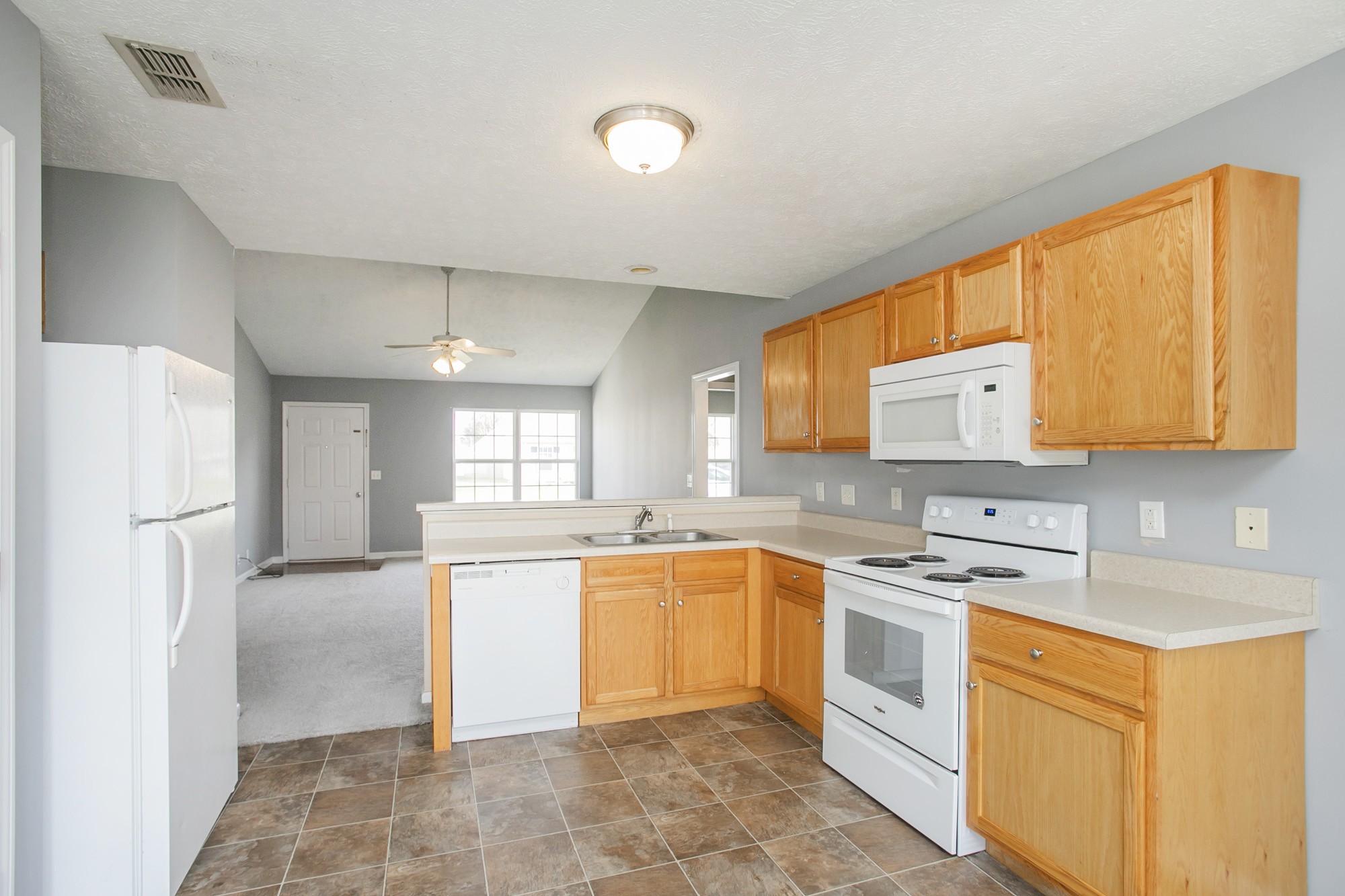 1516 Holden Court Murfreesboro, TN 37128 - Photo 4 of 23 a kitchen with stainless steel appliances granite countertop a stove sink and refrigerator