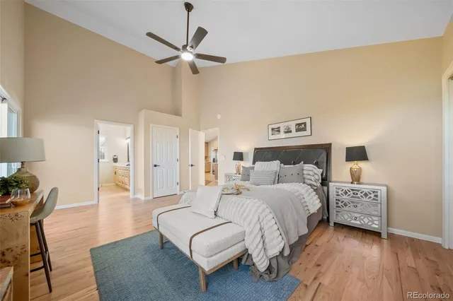 a bedroom with a bed couches and a table