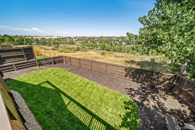 a view of a garden with an ocean view