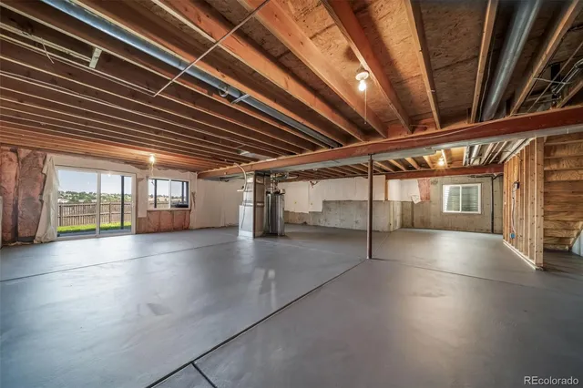 a view of an empty room with windows