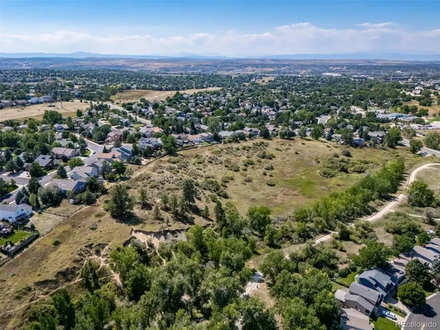 an aerial view of a city and mountain view in back