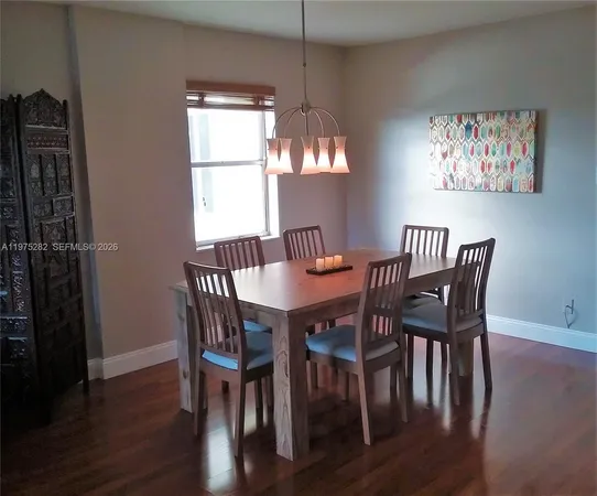 a kitchen with a sink cabinets and utility