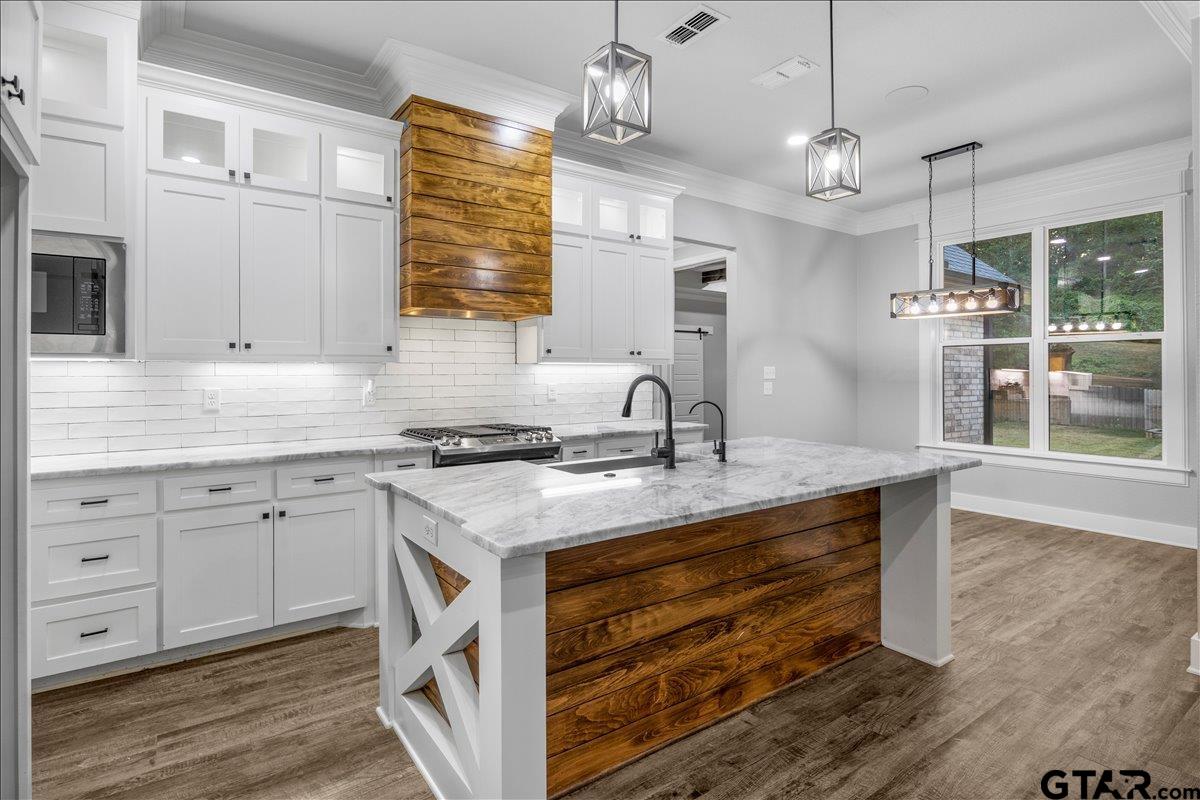 14544 Fallow Lane Lindale, TX 75706 - Photo 15 of 46 a kitchen with cabinets appliances and a counter space