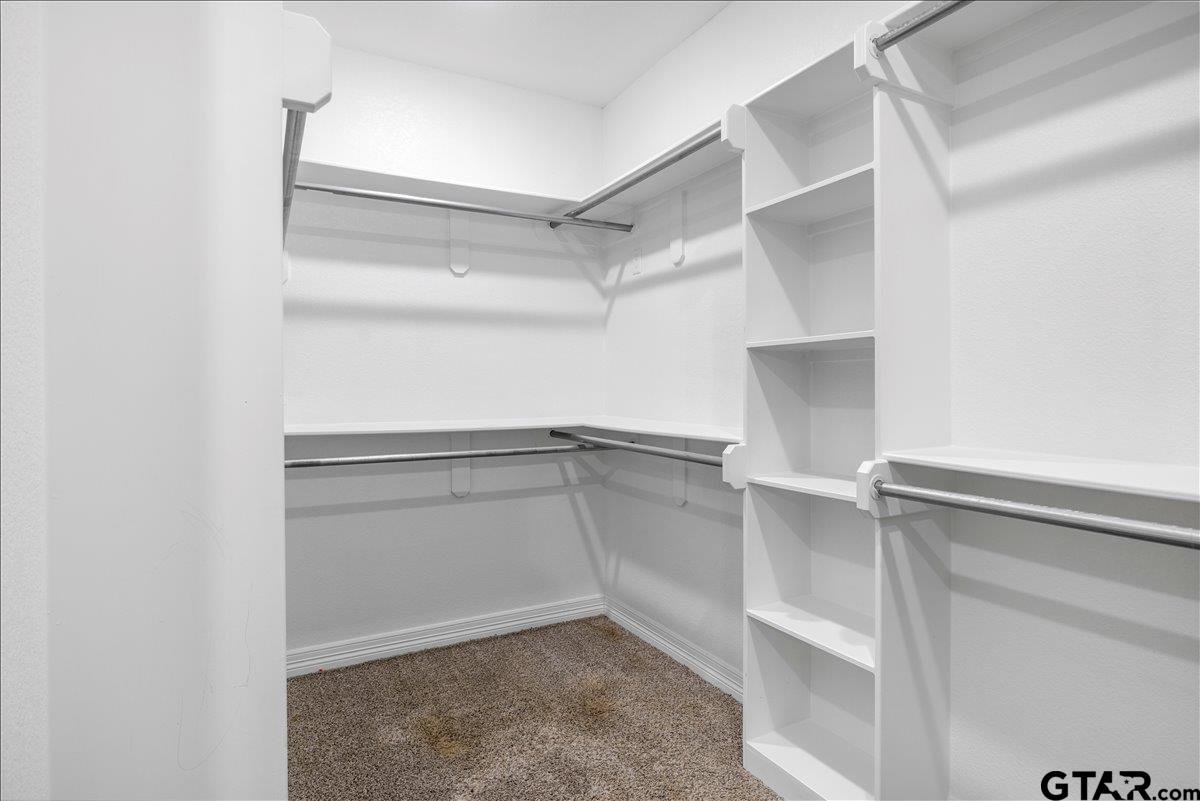 14544 Fallow Lane Lindale, TX 75706 - Photo 27 of 46 a view of an empty walk in closet