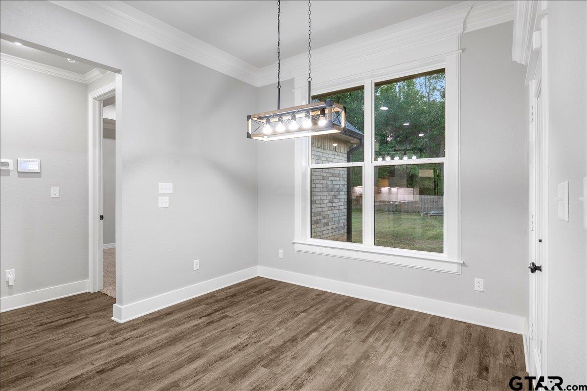 14544 Fallow Lane Lindale, TX 75706 - Photo 30 of 46 a view of a room with wooden floor a ceiling fan and windows