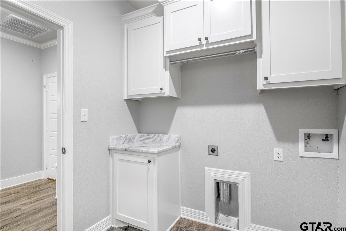 14544 Fallow Lane Lindale, TX 75706 - Photo 34 of 46 a view of cabinets and wooden floor