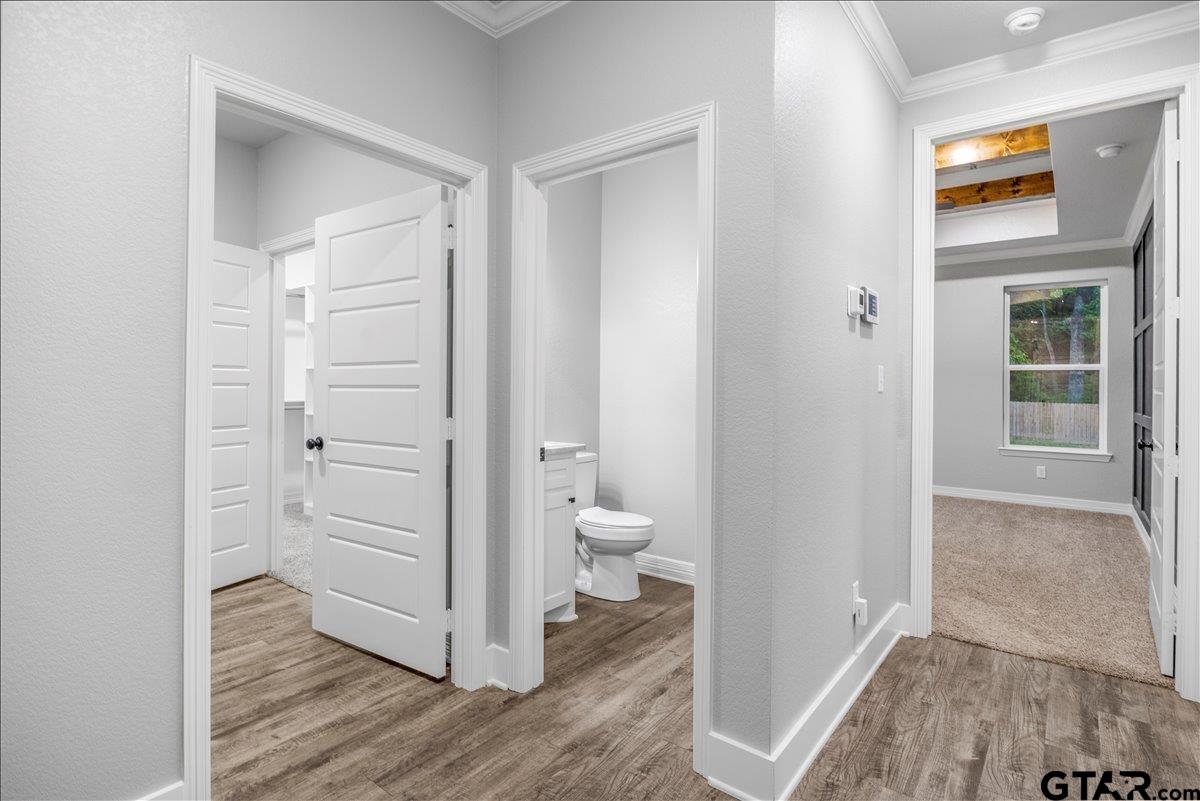 14544 Fallow Lane Lindale, TX 75706 - Photo 35 of 46 a bathroom with a toilet a sink and a mirror