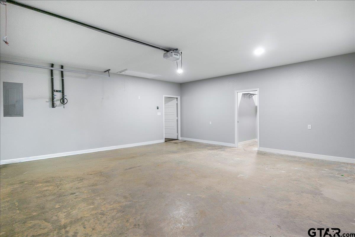 14544 Fallow Lane Lindale, TX 75706 - Photo 40 of 46 an empty room with windows and ceiling fan