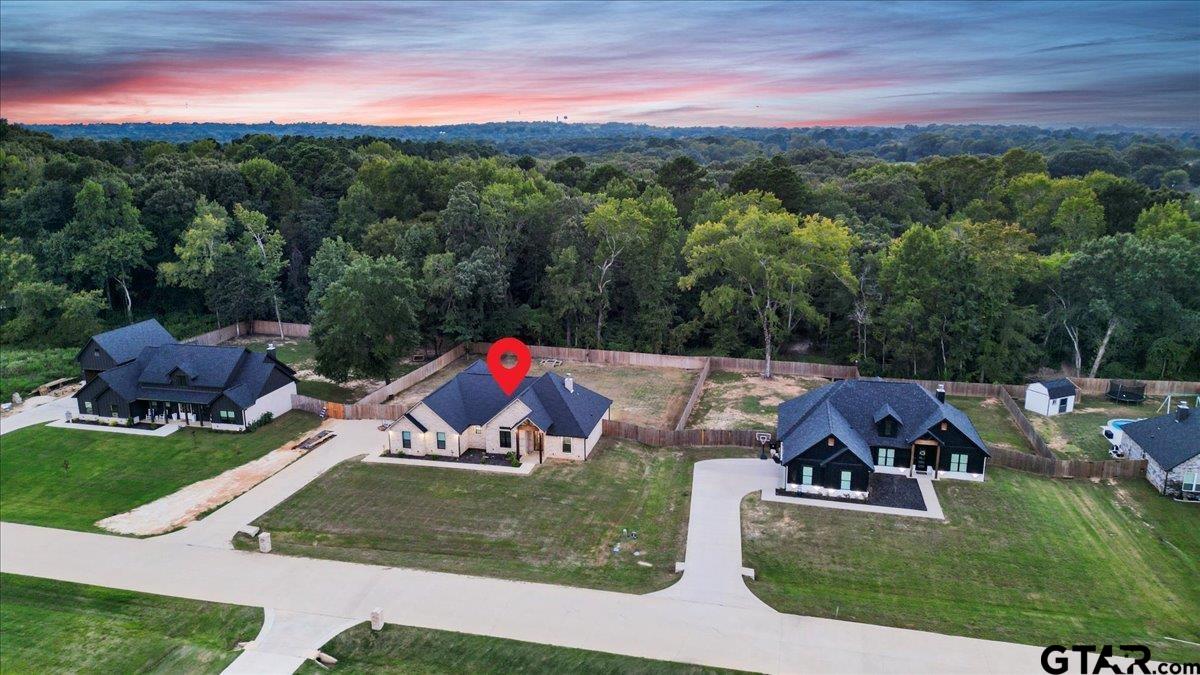 14544 Fallow Lane Lindale, TX 75706 - Photo 44 of 46 a view of a house with a yard and sitting area