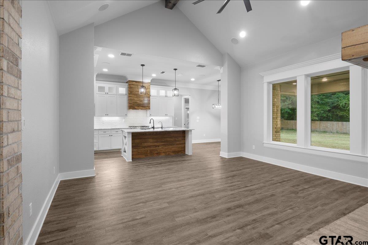 14544 Fallow Lane Lindale, TX 75706 - Photo 7 of 46 a view of kitchen with wooden floor and windows