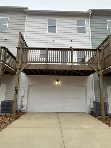 a view of a patio with a table and chairs