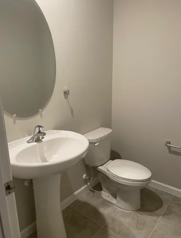 a view of a patio with a table and chairs