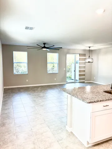 a white toilet sitting next to a bathroom sink