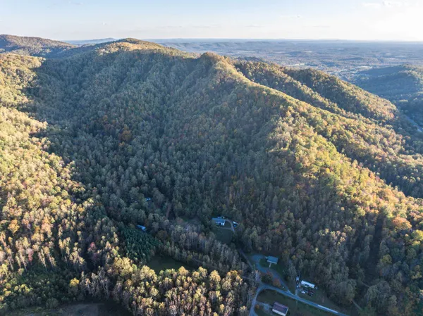 a aerial view of house with a yard