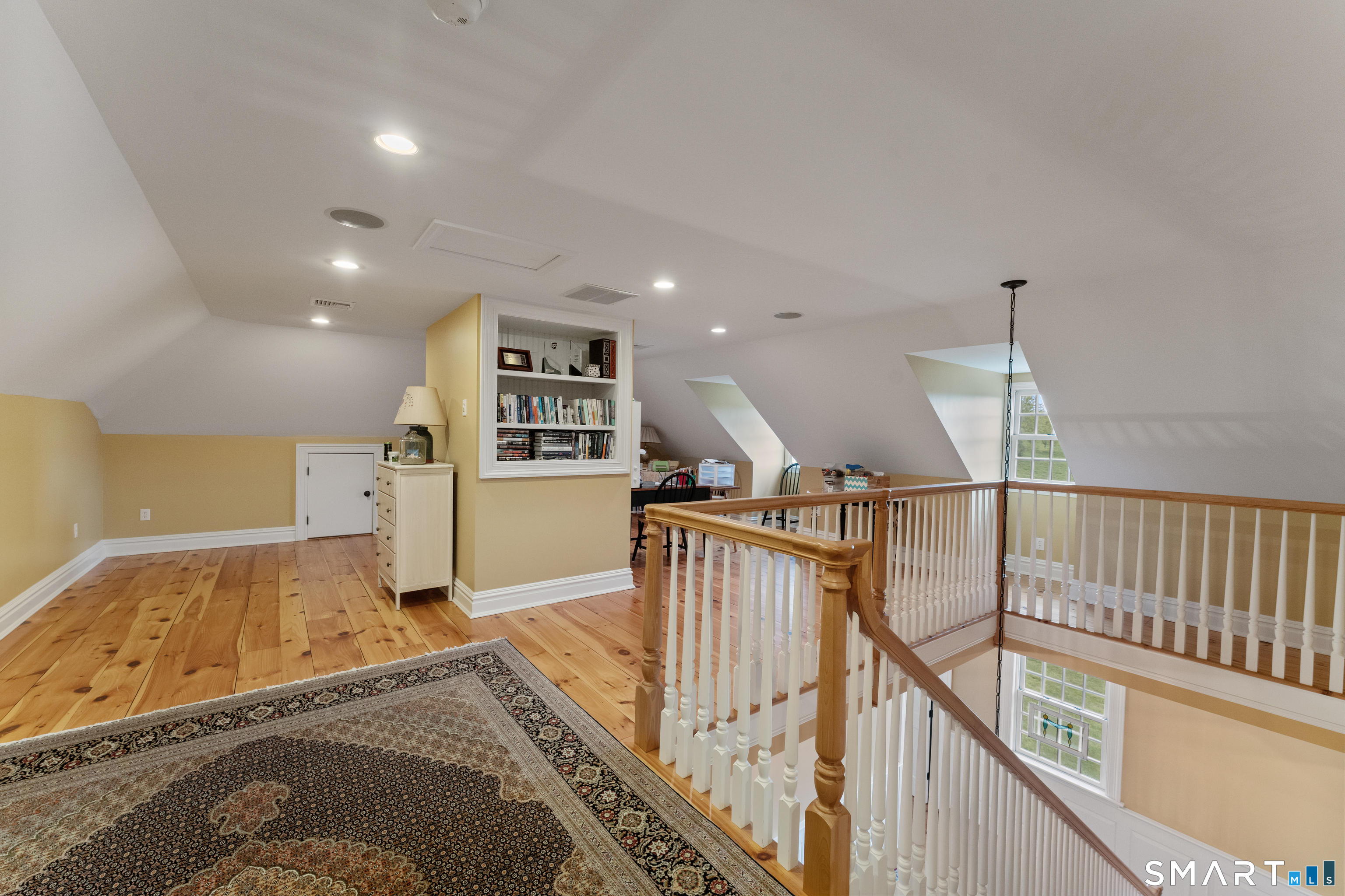 155 Paine Road Woodstock, CT 06281 - Photo 31 of 40 a view of a hallway with wooden floor and stairs
