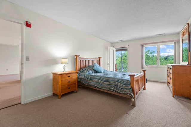 a bedroom with furniture and windows