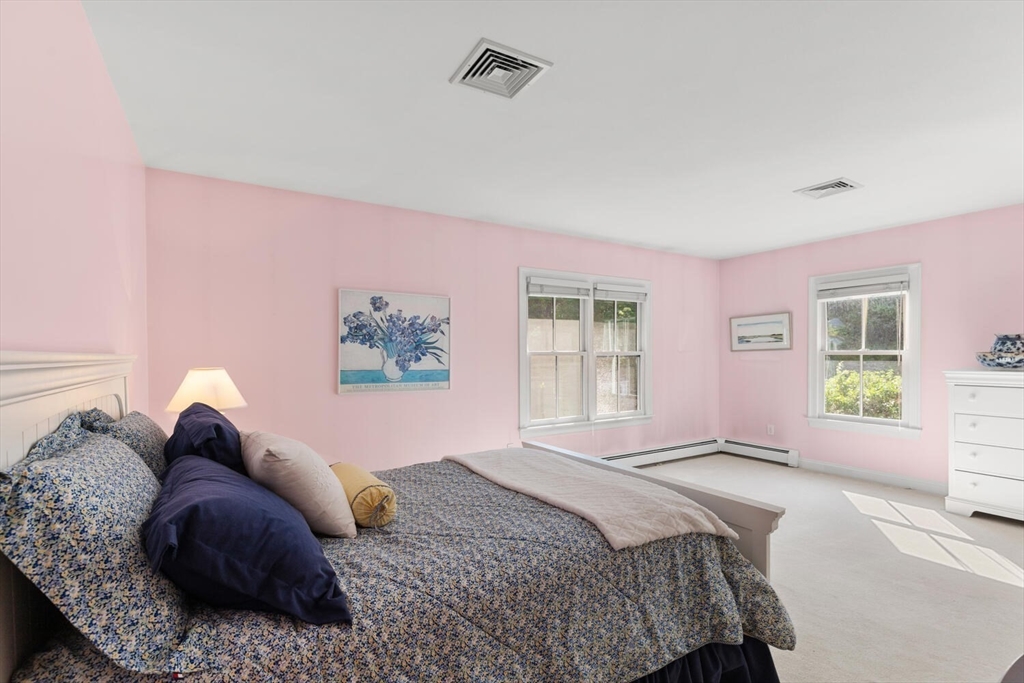 56 Brook Street, Unit B Manchester, MA 01944 - Photo 18 of 37 a bedroom with a bed and a window