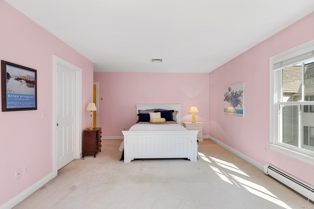 56 Brook Street, Unit B Manchester, MA 01944 - Photo 20 of 37 a bedroom with a bed and a window