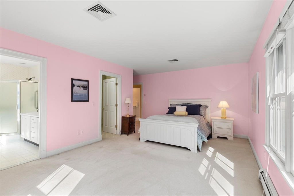 56 Brook Street, Unit B Manchester, MA 01944 - Photo 21 of 37 a bedroom with a bed and window