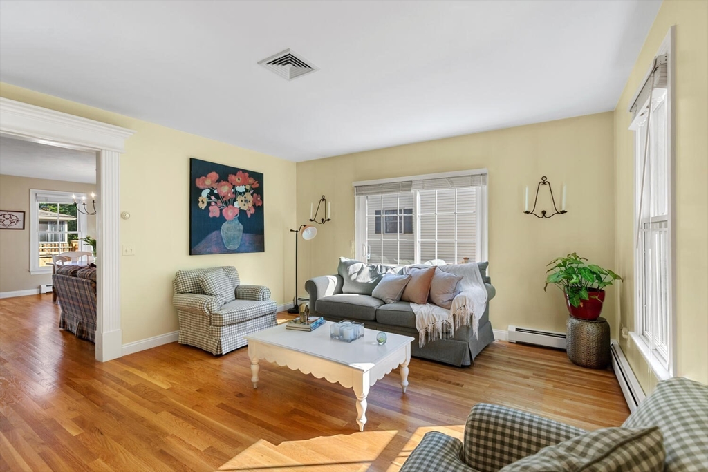 56 Brook Street, Unit B Manchester, MA 01944 - Photo 3 of 37 a living room with furniture or couch and a potted plant