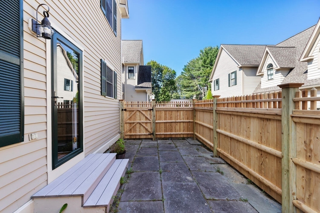 56 Brook Street, Unit B Manchester, MA 01944 - Photo 31 of 37 a view of a house with a balcony