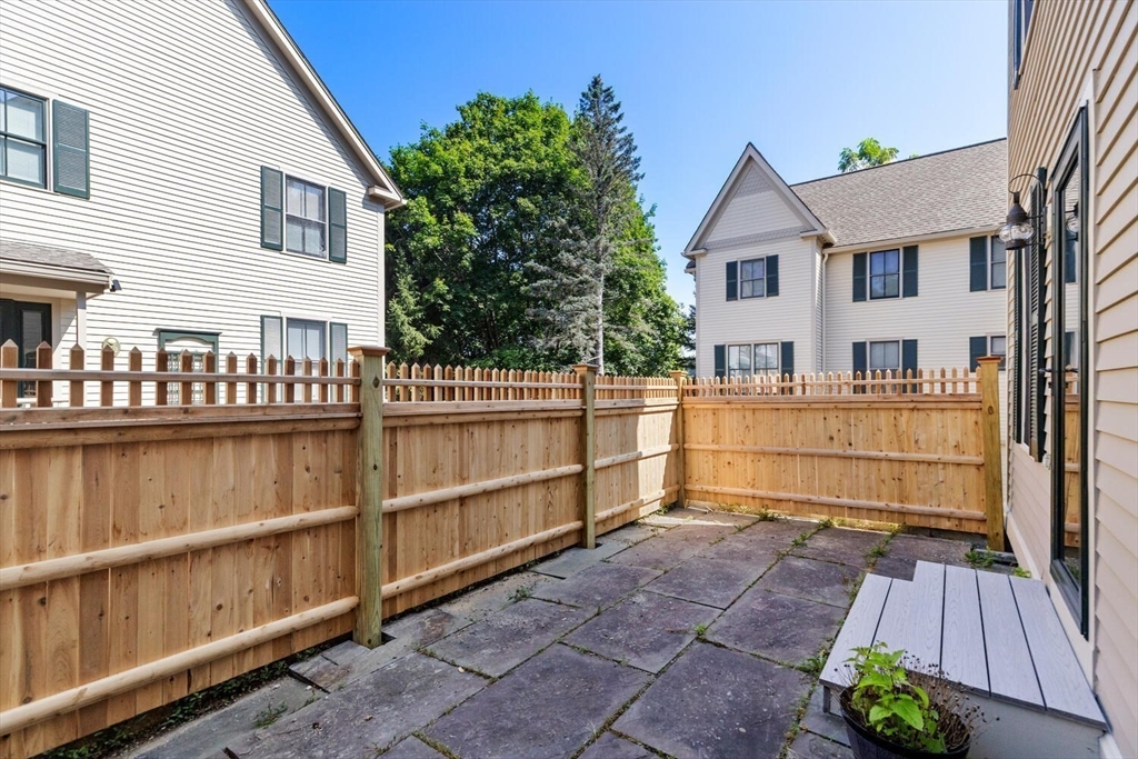 56 Brook Street, Unit B Manchester, MA 01944 - Photo 32 of 37 a view of a house with a balcony