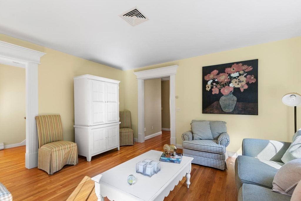 56 Brook Street, Unit B Manchester, MA 01944 - Photo 7 of 37 a living room with furniture and a wooden floor
