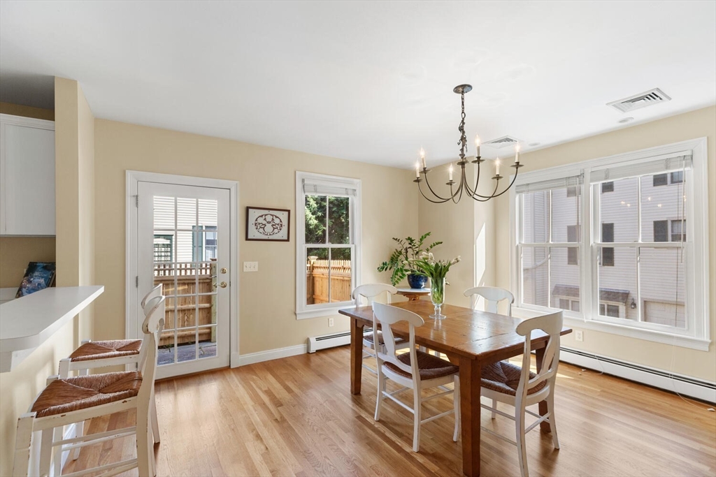 56 Brook Street, Unit B Manchester, MA 01944 - Photo 9 of 37 a view of a dining room with furniture window and wooden floor