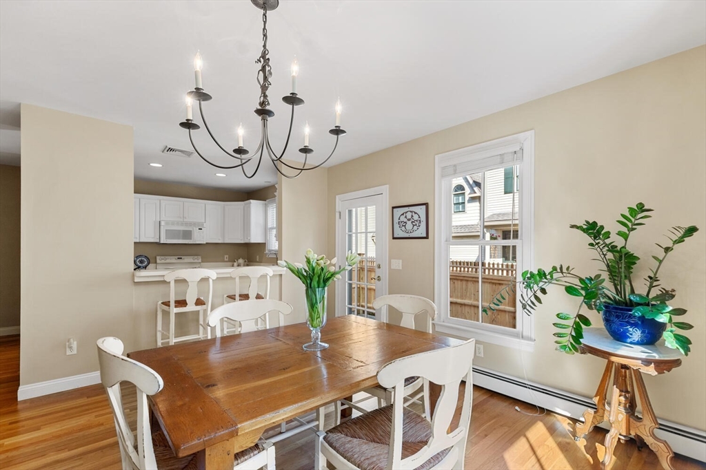 56 Brook Street, Unit B Manchester, MA 01944 - Photo 10 of 37 a view of a dining room with furniture window and wooden floor
