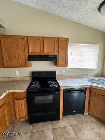 a kitchen with a stove and a sink
