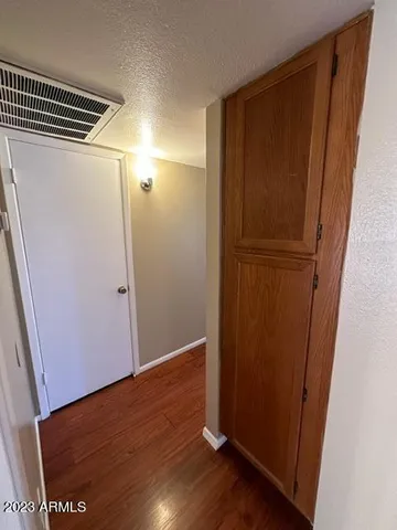 an empty room with wooden floor