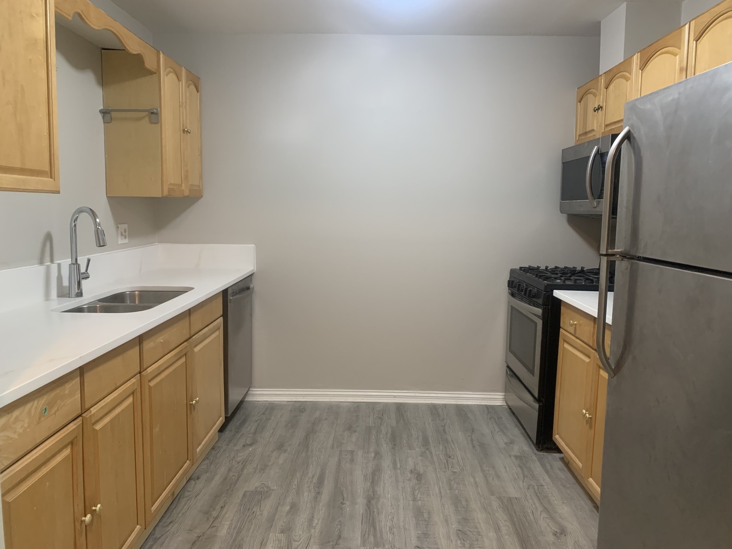 264 East Bailey Road, Unit L Naperville, IL 60565 - Photo 2 of 17 a bathroom with a sink and a mirror