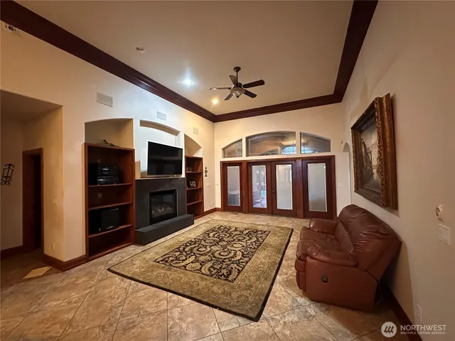 a view of a hallway with wooden floor and workspace
