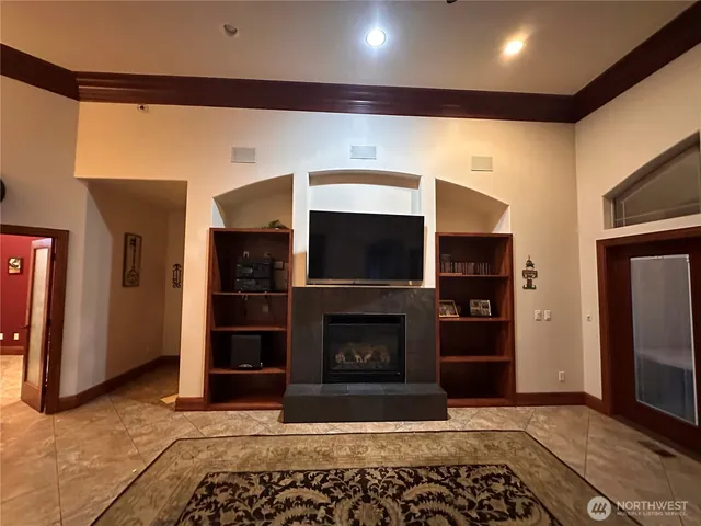 a view of a dining room with furniture and a chandelier