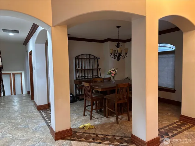 a bedroom with furniture and a chandelier