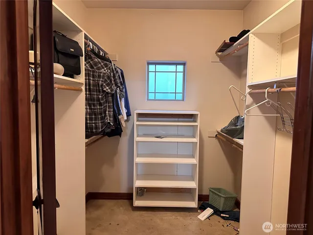 a bathroom with a tub and shower