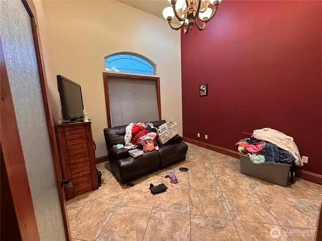 a bathroom with a granite countertop sink mirror vanity and toilet