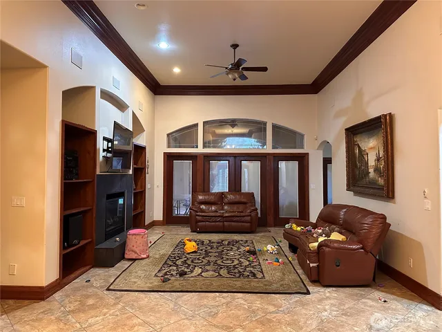 a living room with furniture and a fireplace