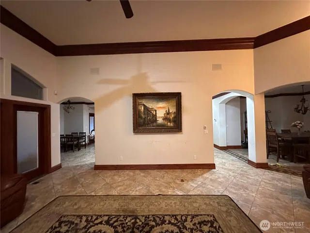 a living room with a large window and a flat screen tv