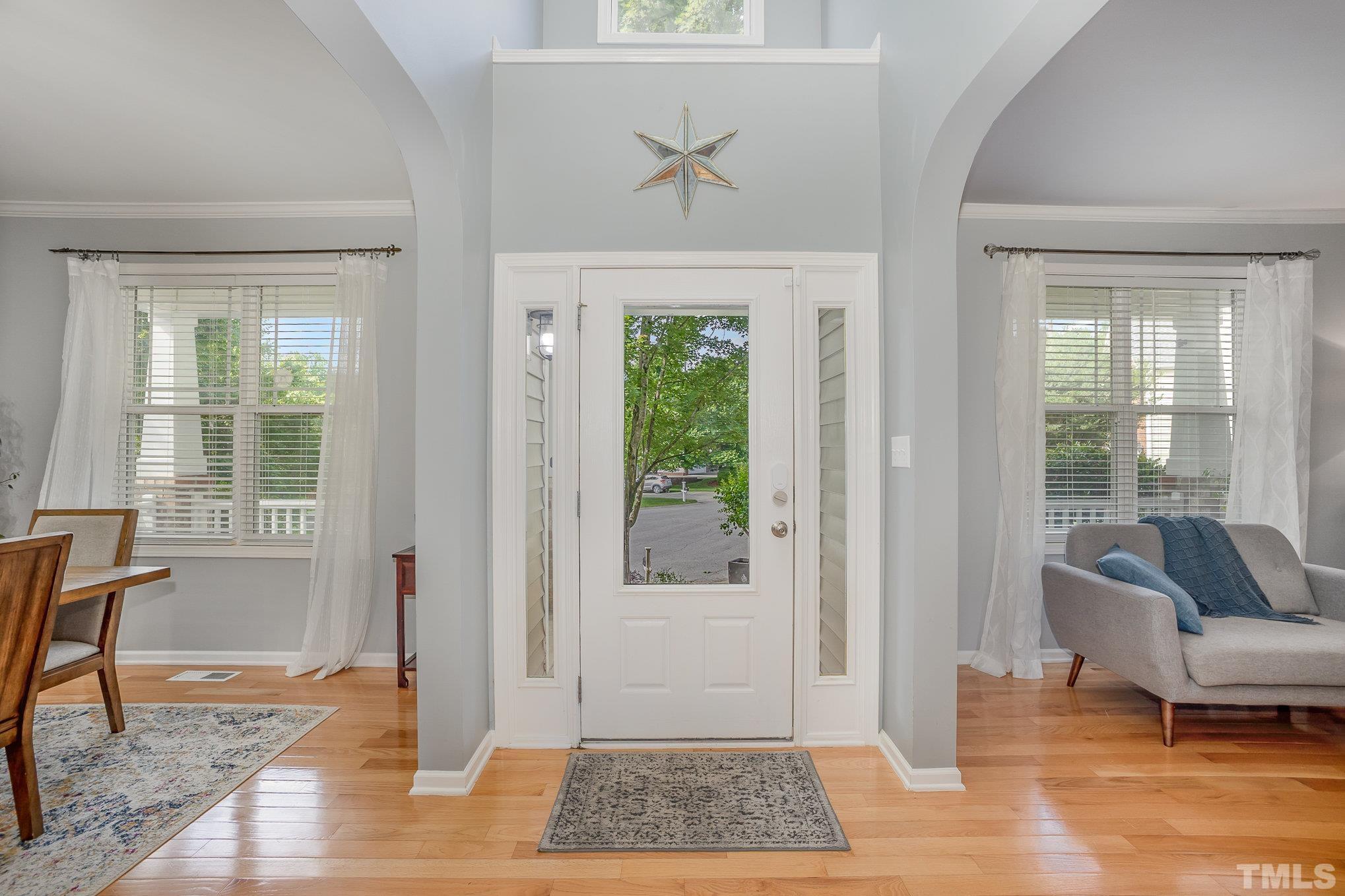 8404 Dunnington Circle Raleigh, NC 27613 - Photo 3 of 28 a living room with furniture and a window