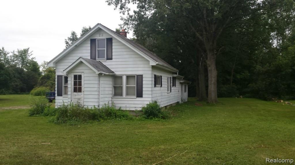 9765 Division Road Casco, MI 48064 - Photo 2 of 11 This is a front angle view of the home.