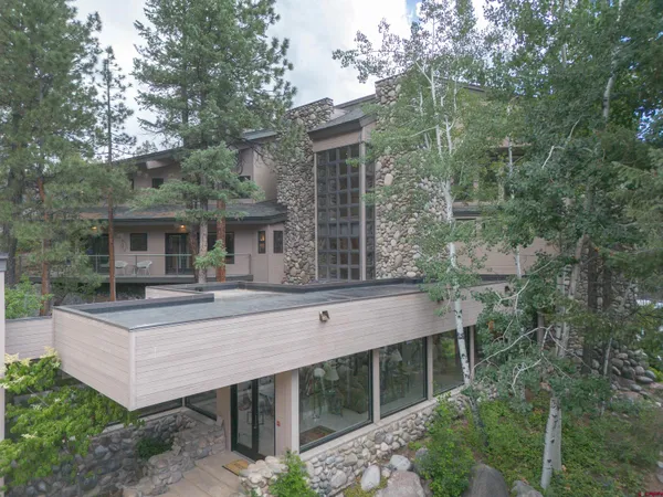 a view of house with yard outdoor seating and barbeque oven