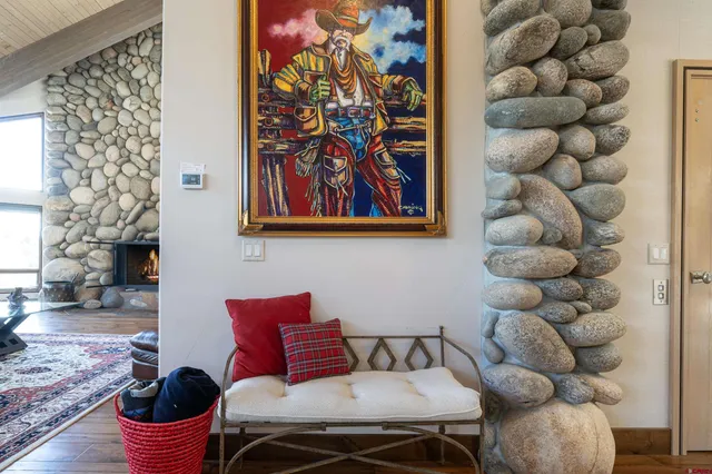 a kitchen with furniture and a large window