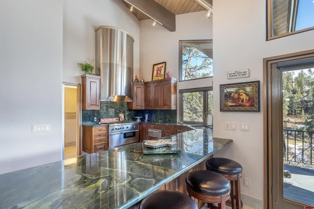 a kitchen with a stove a sink and a microwave