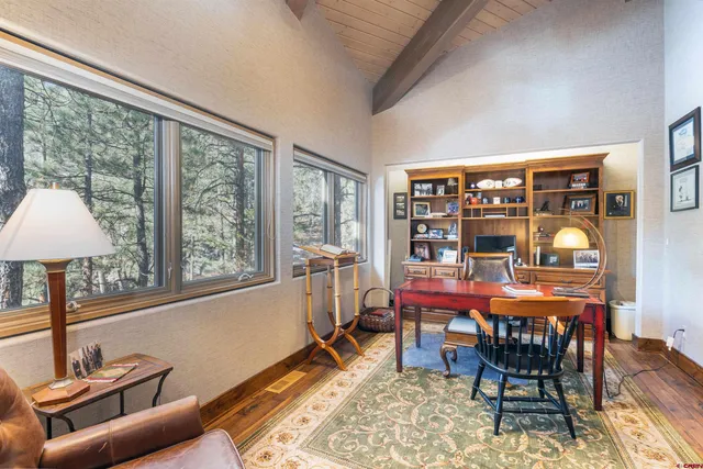 a view of an entryway with wooden floor